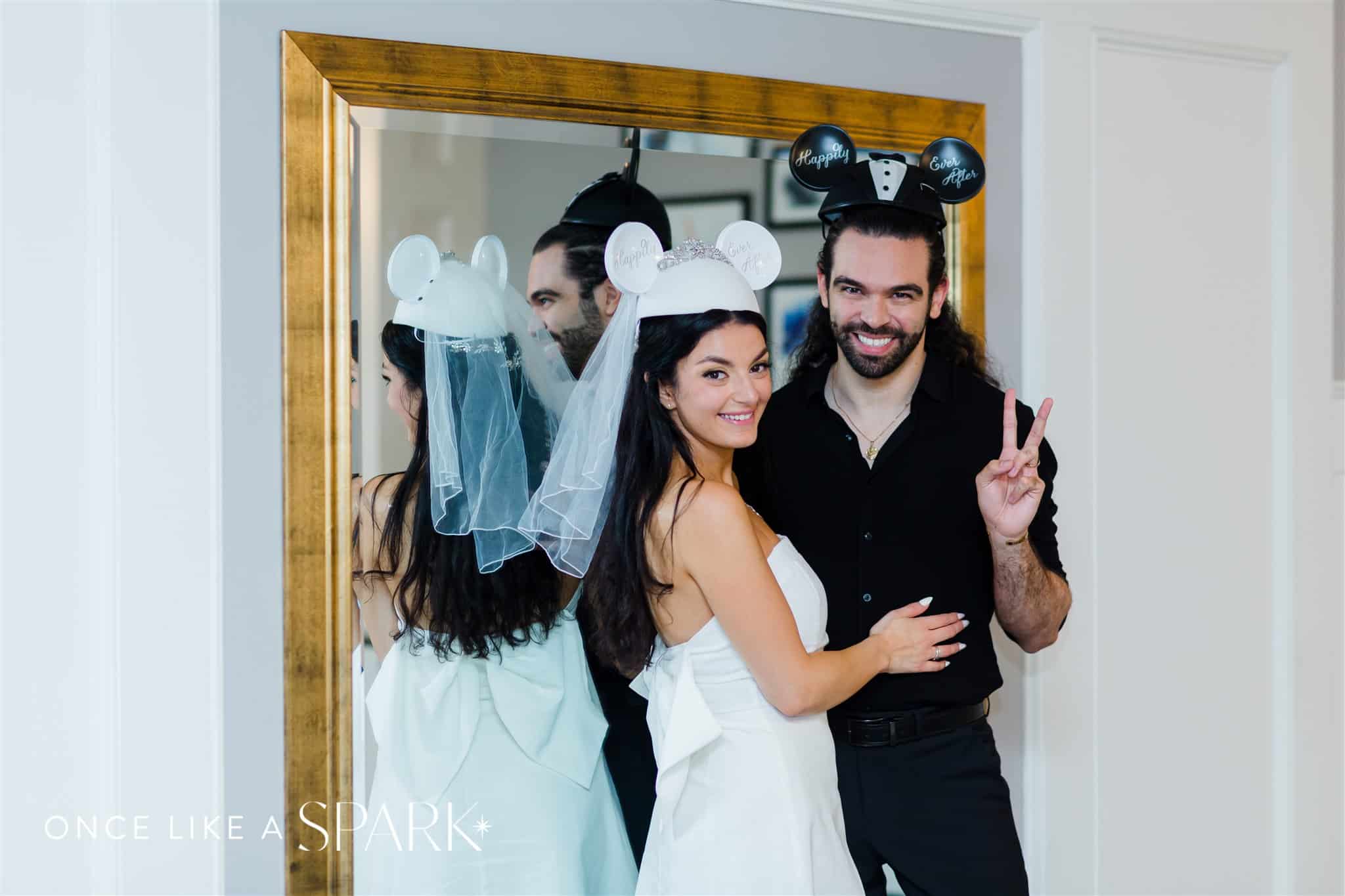 Bride and Groom wearing Mickey and Minnie Ears